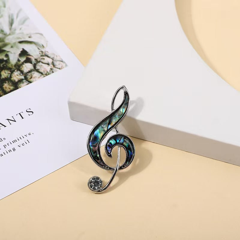 Abalone shell musical note brooch