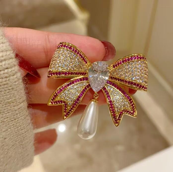 Diamond bow brooch