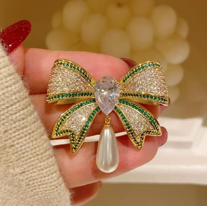 Diamond bow brooch