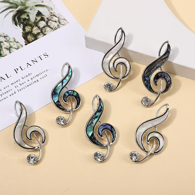 Abalone shell musical note brooch